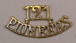121 PIONEERS cast brass shoulder title
