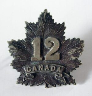 12th BN. C.E.F. Dark oxidised white metal Cap Badge original