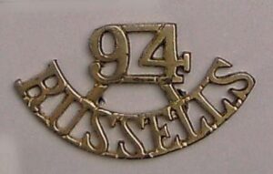 94th RUSSELS curved cast brass  shoulder title