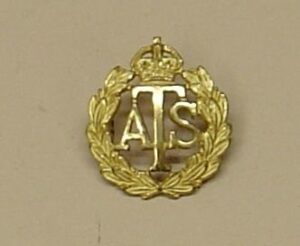 A .T.S., K.C., Officer's gilt cap badge