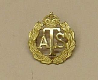 A .T.S., K.C., Officer's gilt cap badge