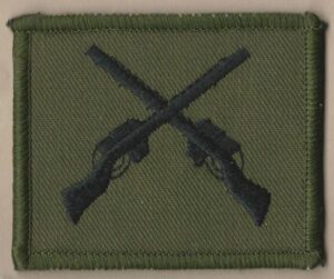 CROSSED RIFLES embroidered black on green patch
