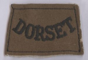 DORSET embroidered black on khaki
