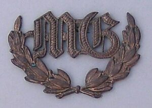 M.G.' in 'OLD ENGLISH' in WREATH gilding metal