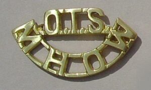 OTS-MHOW cast brass shoulder title
