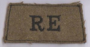 R.E. embroidered black on a light khaki