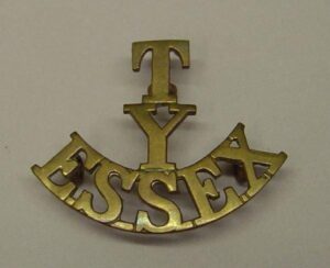 T-Y-ESSEX brass shoulder title