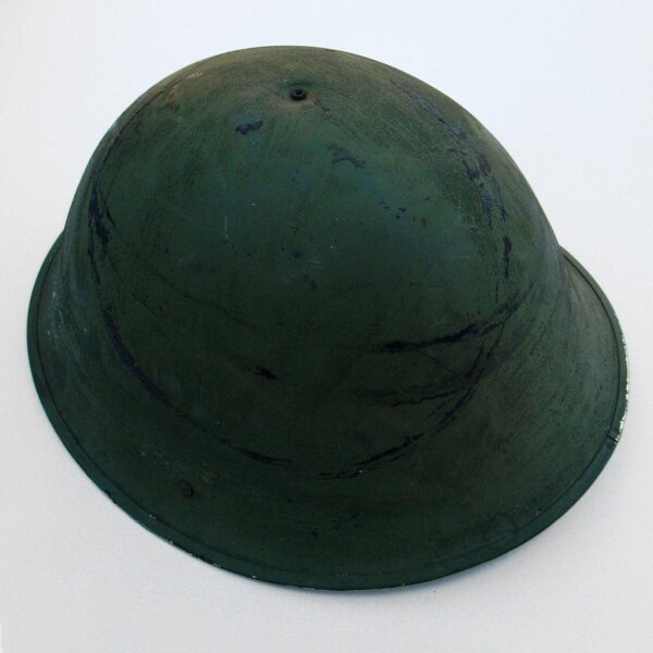 BRITISH 1944 Turtle Pattern Steel Combat Helmet complete with liner and elasticated chin-strap.