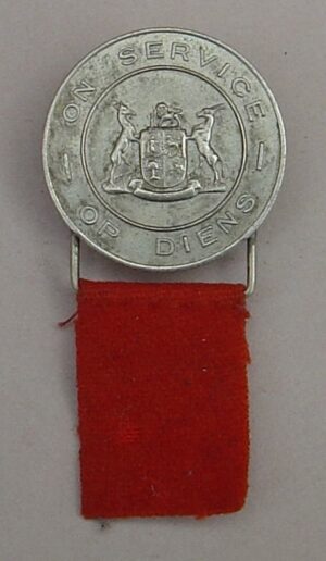 The SOUTH AFRICA WWII for 'On Service' - DISCHARGED SERVICEMAN BADGE -  nickel with 'orange' cloth tag