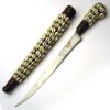 NORTH AFRICA DAGGER with Cowrie shell decorated scabbard.